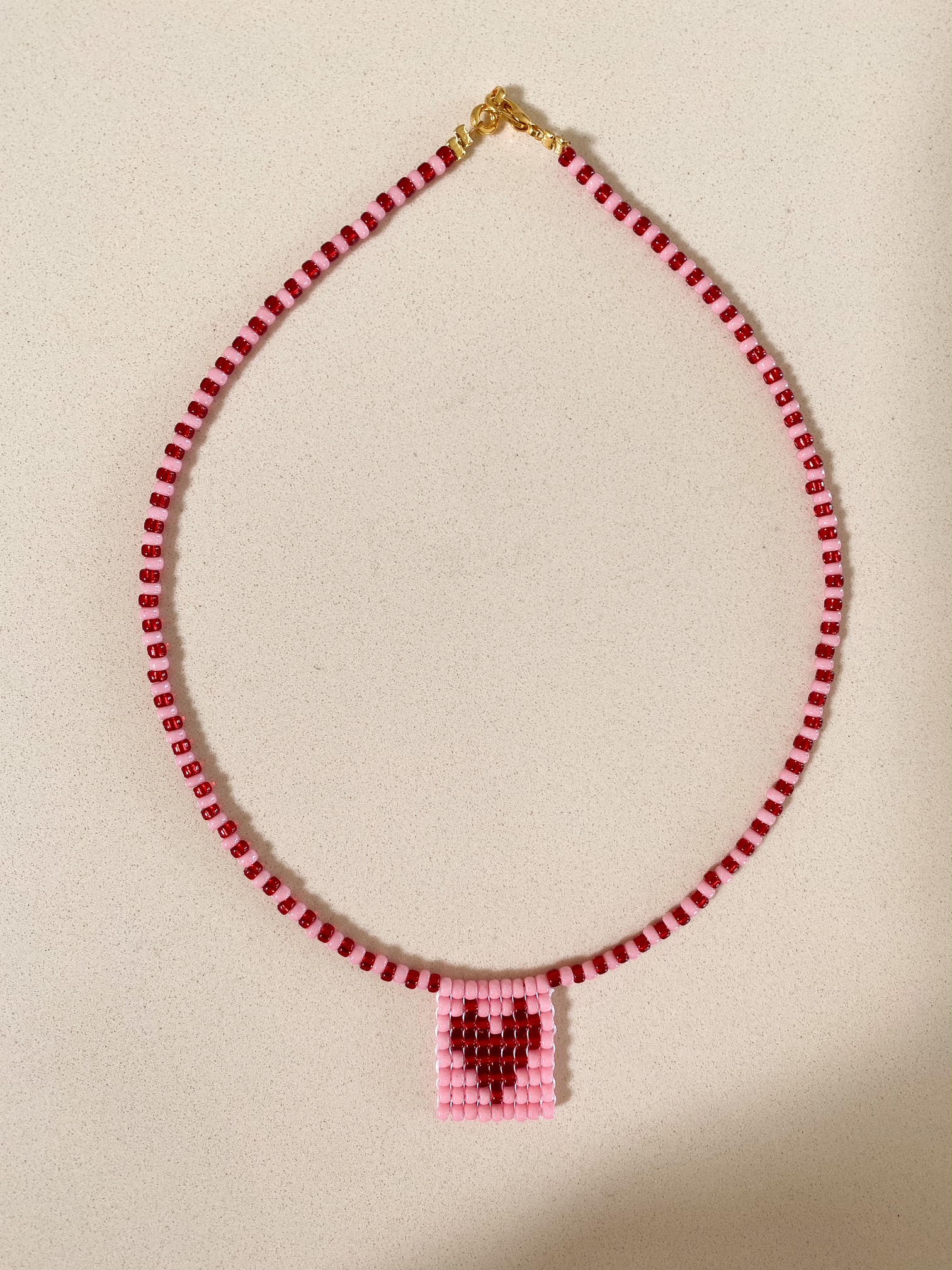 Kette mit Perlenanhänger Herz rosa-rot