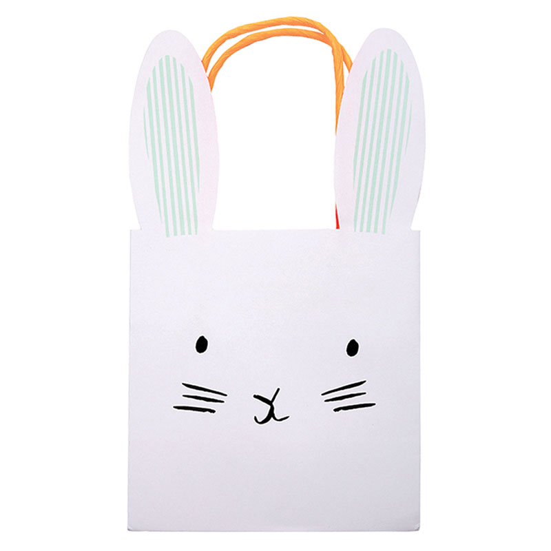 453107b Weiße Geschenktasche, Hasengesicht-Aufdruck, aufgestellte Ohren, orangefarbene Griffe.