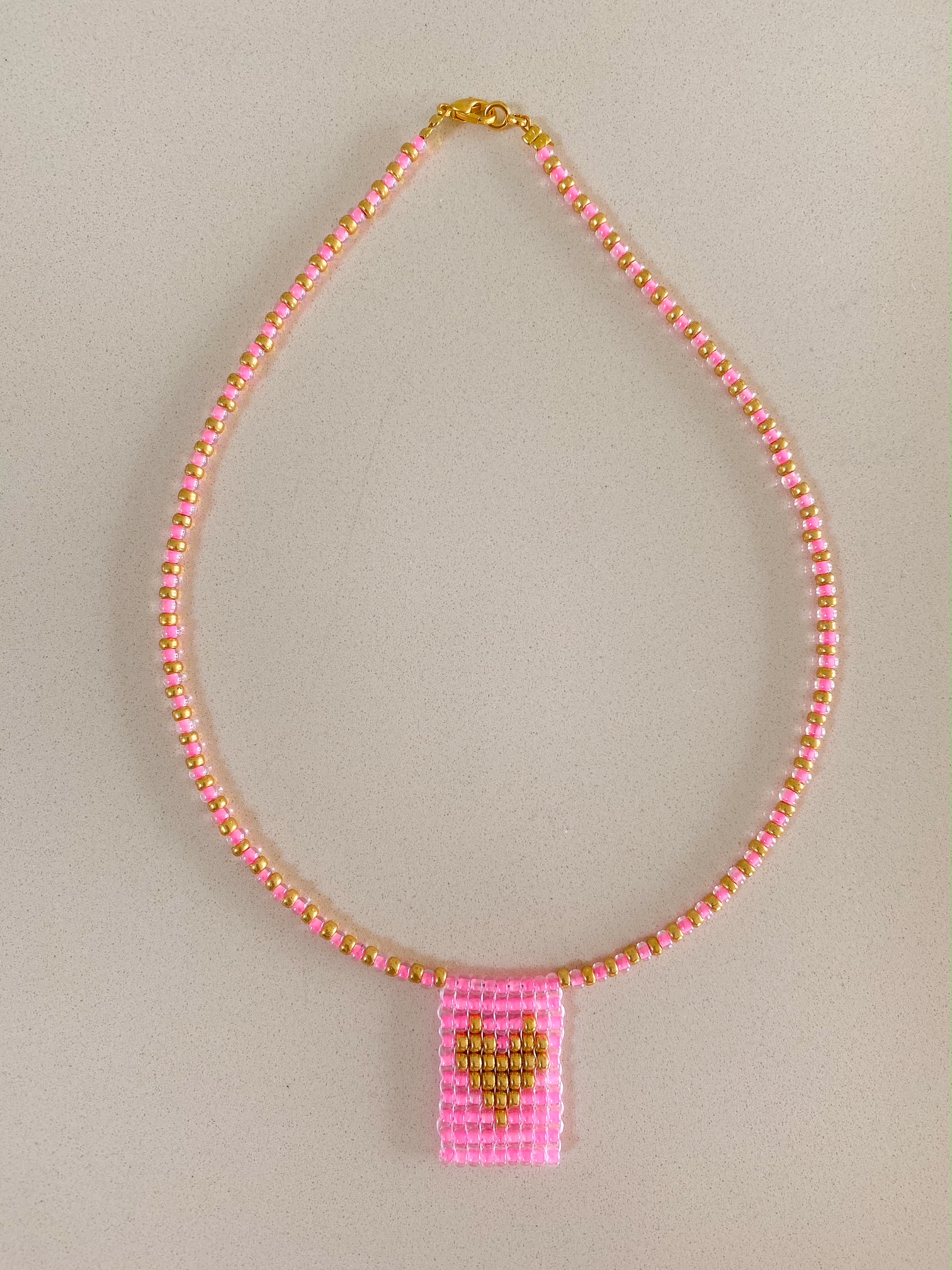 Kette mit Perlenanhänger Herz gold pink