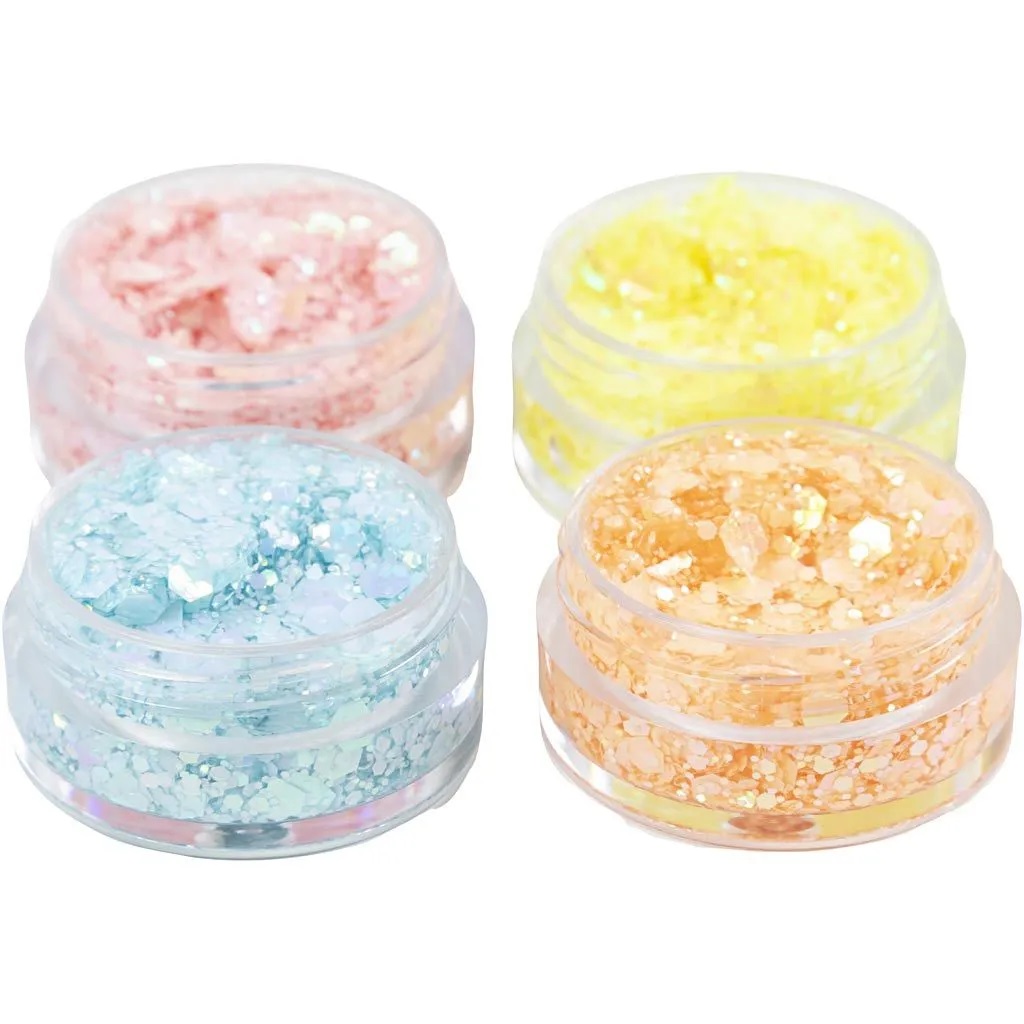 Vier runde Dosen mit Glitzer in Pastellfarben; rosa, gelb, blau, orange; durchsichtige Verpackung; glanzvolle Partikel.
